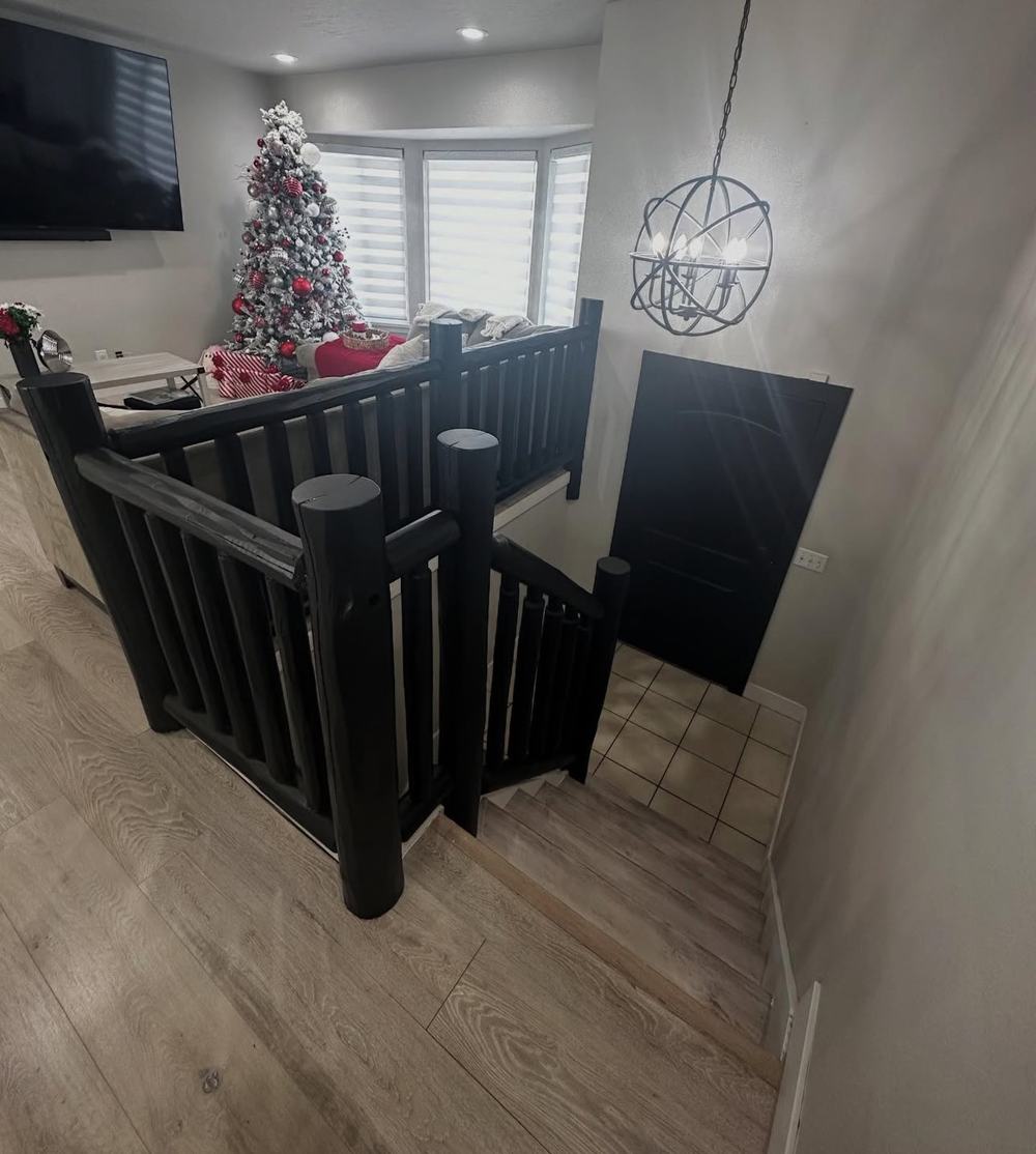 Finished stairwell with dark wood railings