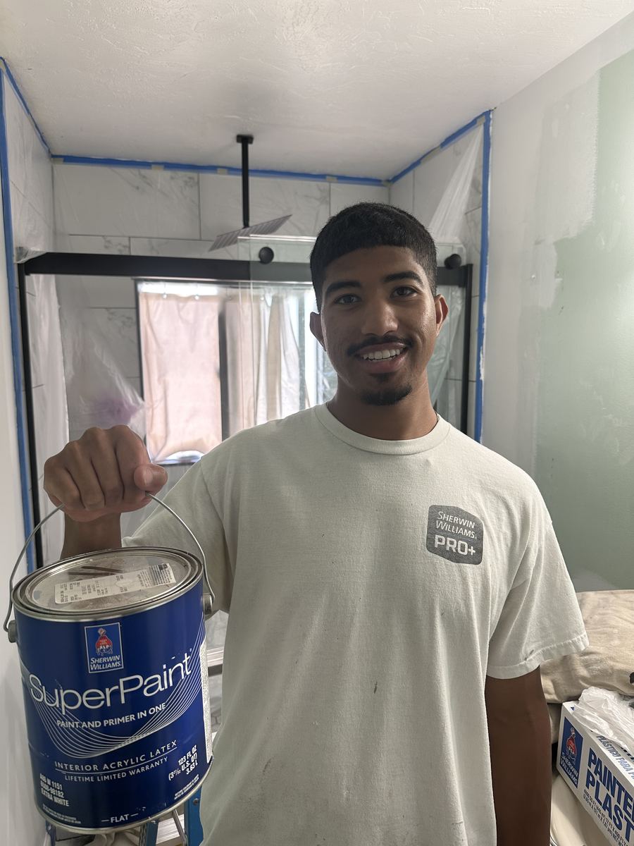 Valley Painters LLC co-owner on a job site with Sherwin Williams SuperPaint