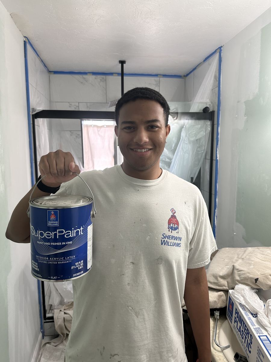 Valley Painters LLC co-owner on a job site with Sherwin Williams SuperPaint